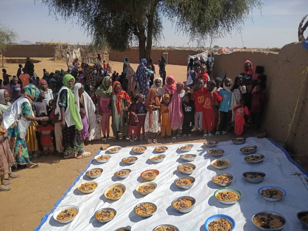 Meal Preparation - Volunteers cooking large pots
